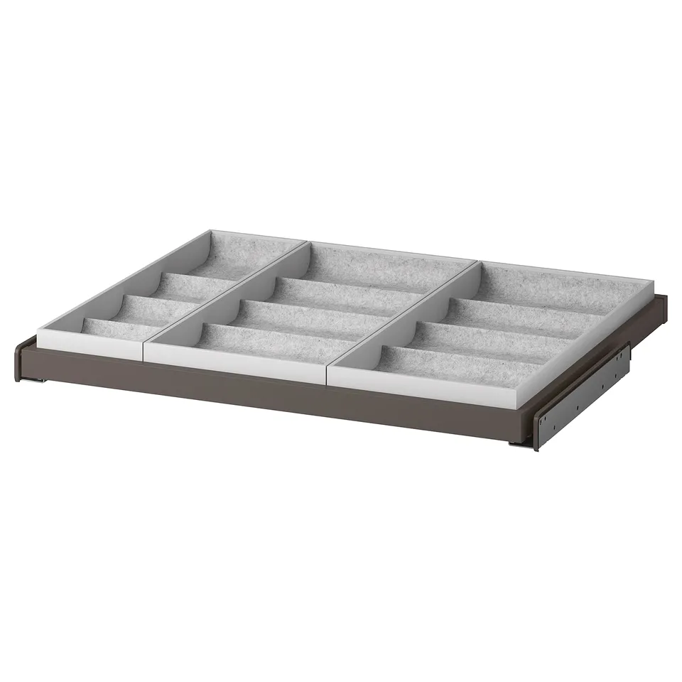 An IKEA KOMPLEMENT pull-out organiser tray in grey for storing accessories.