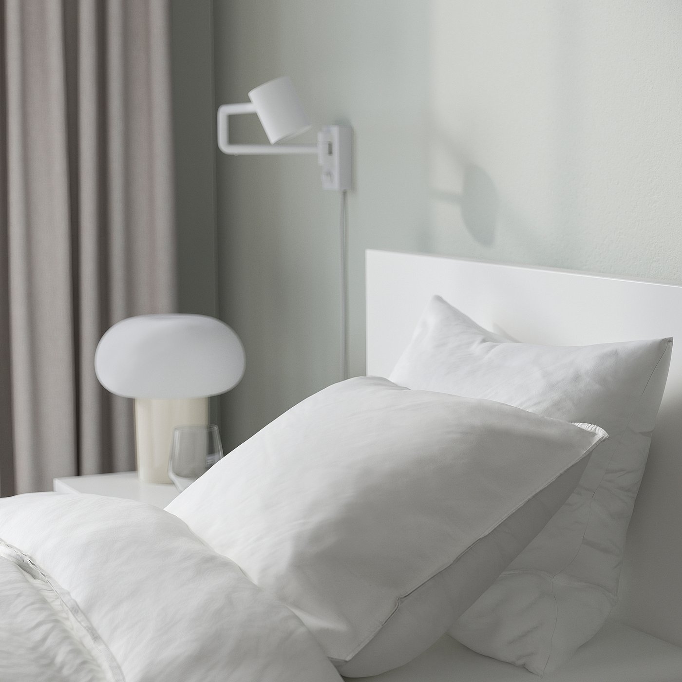 Minimalist bedroom with MALM bed, wall & table lamps for reading.