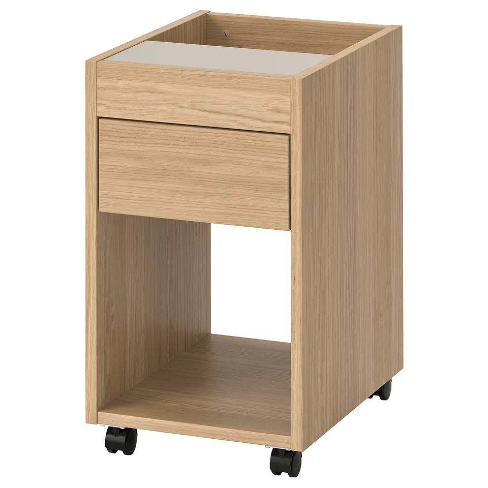Light oak TONSTAD drawer unit; single drawer, casters, modern.