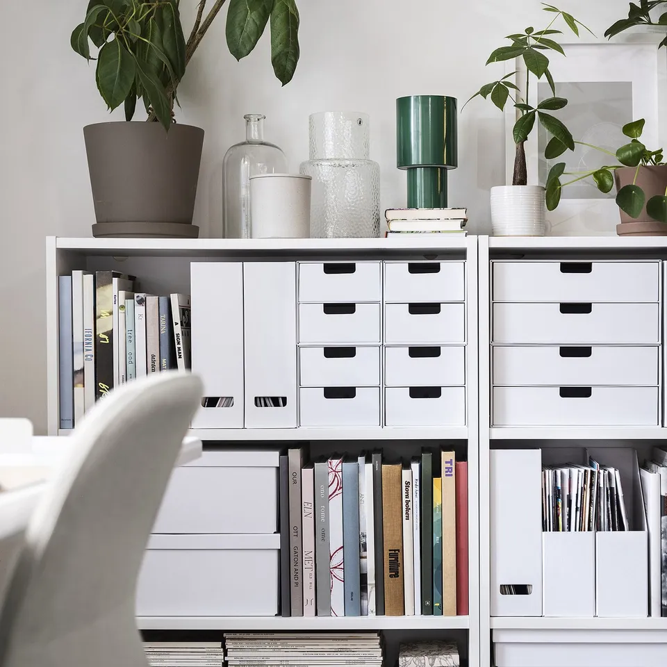White FJÄDERHARV box on shelf, stores books & papers, fits neatly with other storage units.