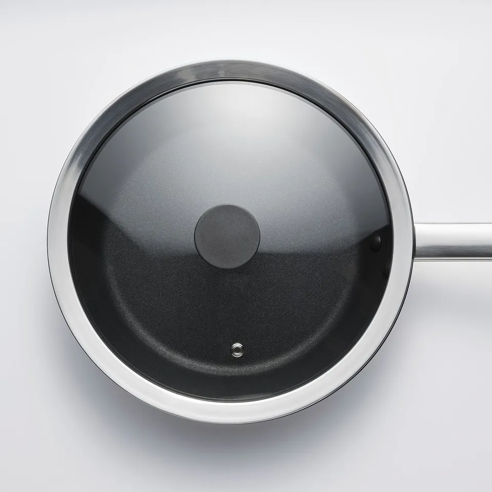 Image shows a clear, sturdy glass lid designed for pots and pans, fitting 24 cm frying pans or 8 litre pots.