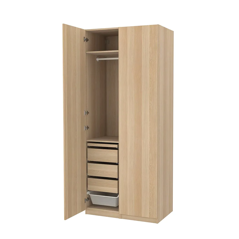 PAX wardrobe: light wood, tall, two doors, three drawers, mesh basket, hanging rail, minimalist design.