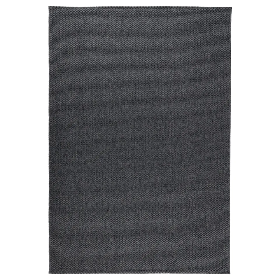 Dark grey, rectangular, flat-woven MORUM rug. Made of 100% polypropylene, suitable for indoor/outdoor use.