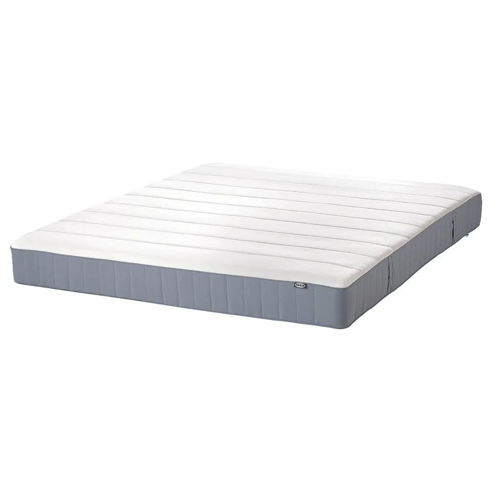 Image depicts a white MALM mattress with grey sides by IKEA.