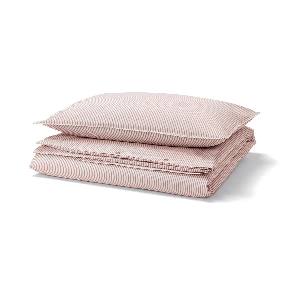 Red and white striped duvet cover and pillowcase set made from 100% cotton, neatly folded.