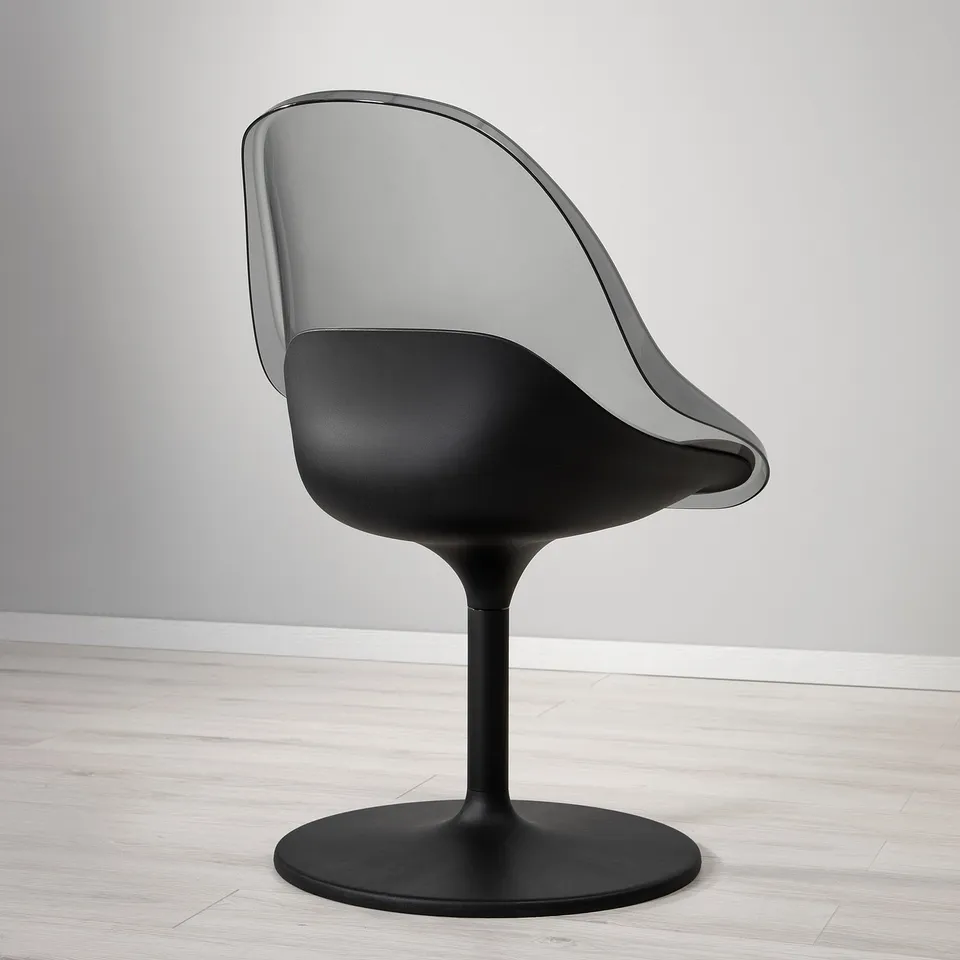 Modern black swivel chair with sleek design. Bowls-shaped seat and curved back. Perfect for dining, comfortable and stylish.