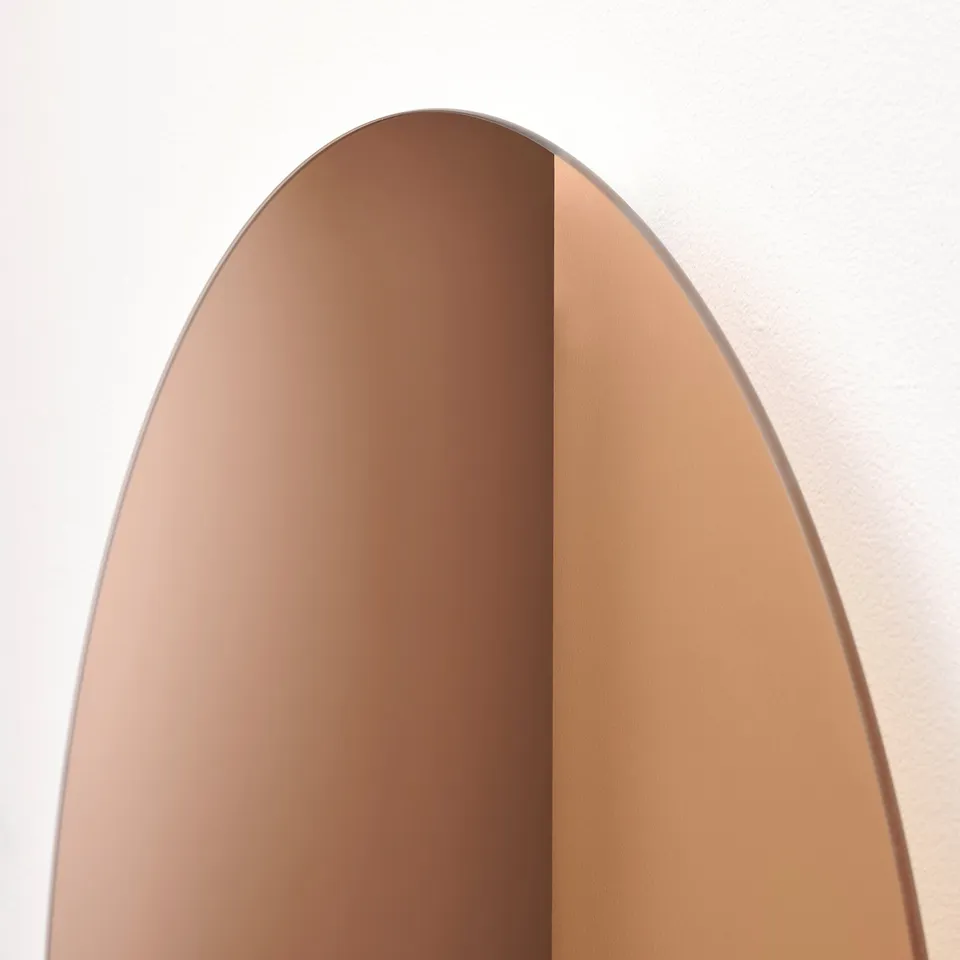 Elegant arched mirror enhances room light.