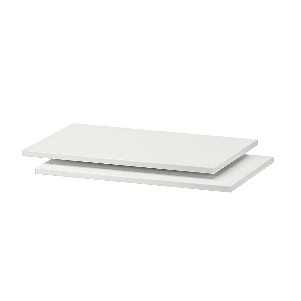 Two white TROFAST shelves, rectangular, plain design, made of particleboard.