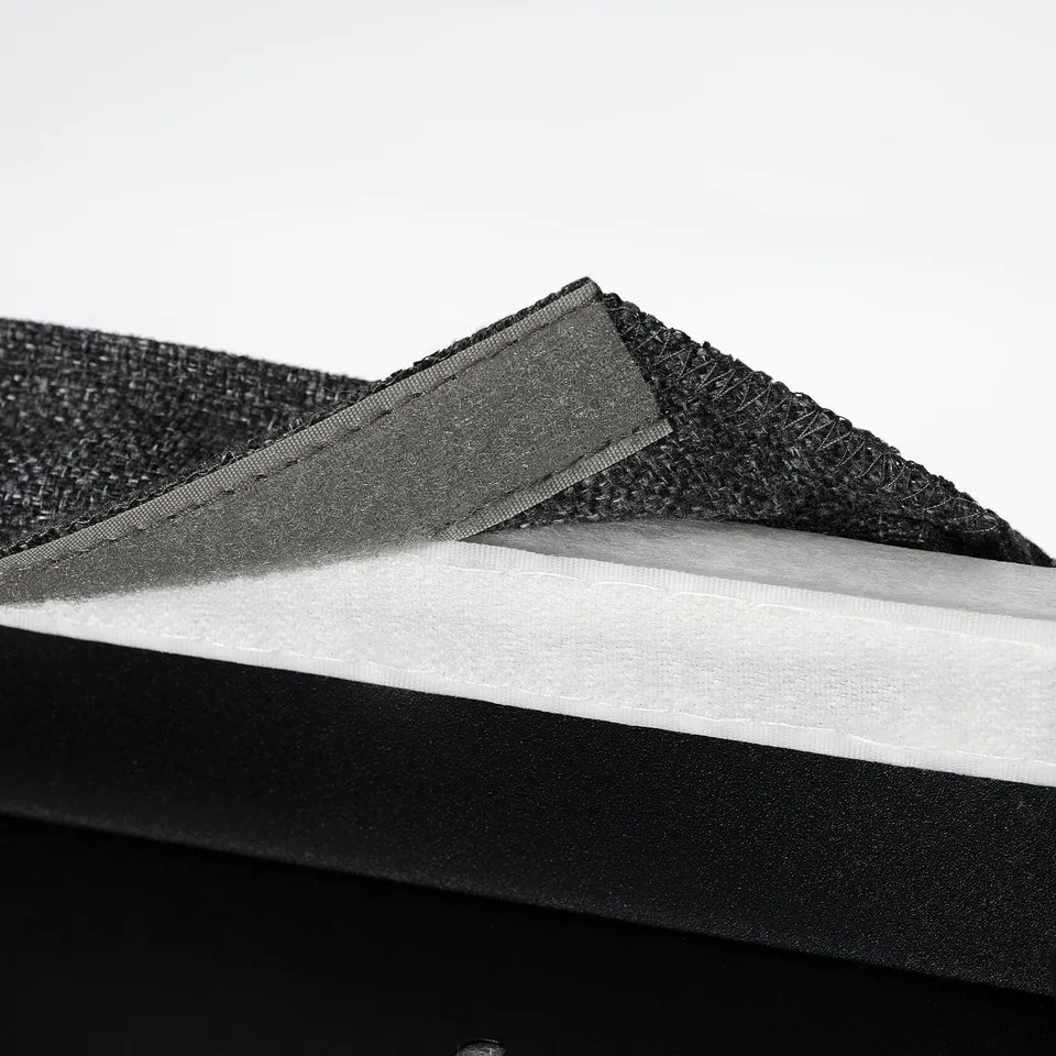 Stacked black upholstered chair covers with foam padding, illustrating comfort and support.