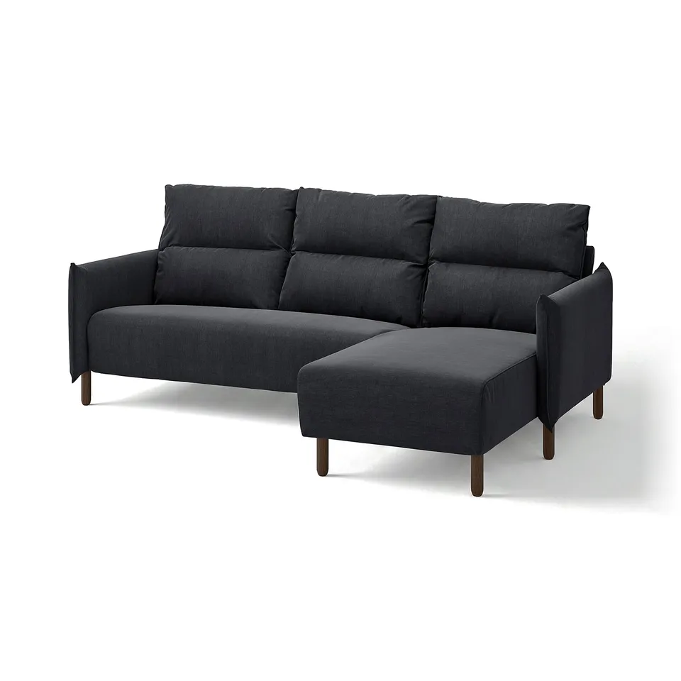 Dark grey MANNARP sofa with chaise, wooden legs, high back, soft cushions.