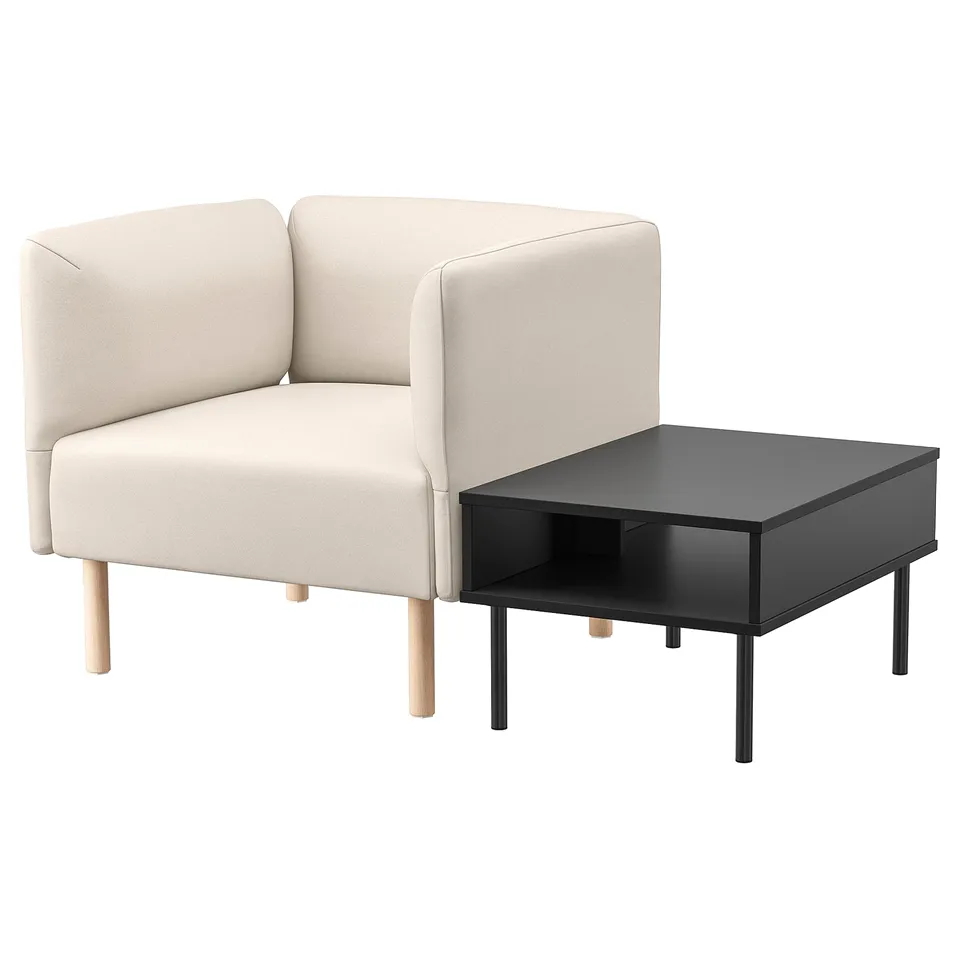 Modern, compact lounge setup. Cream-colored fabric sofa with wooden legs and sleek black side table.