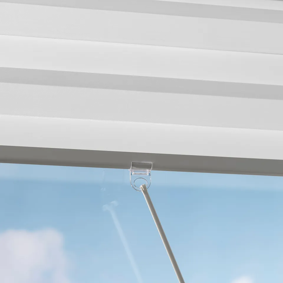 Blind cords looped, showcasing cordless, safe design with soft-close functions.