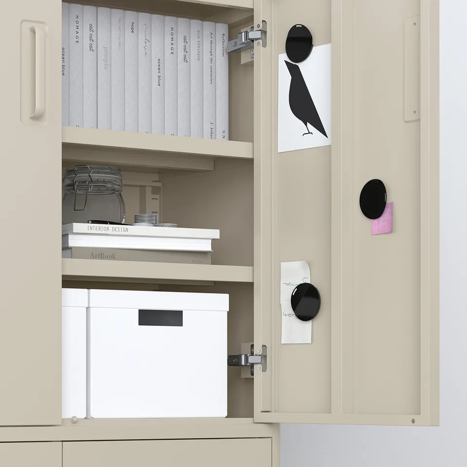 Open beige cabinet showing organised books, boxes, and notes held by magnets on door.