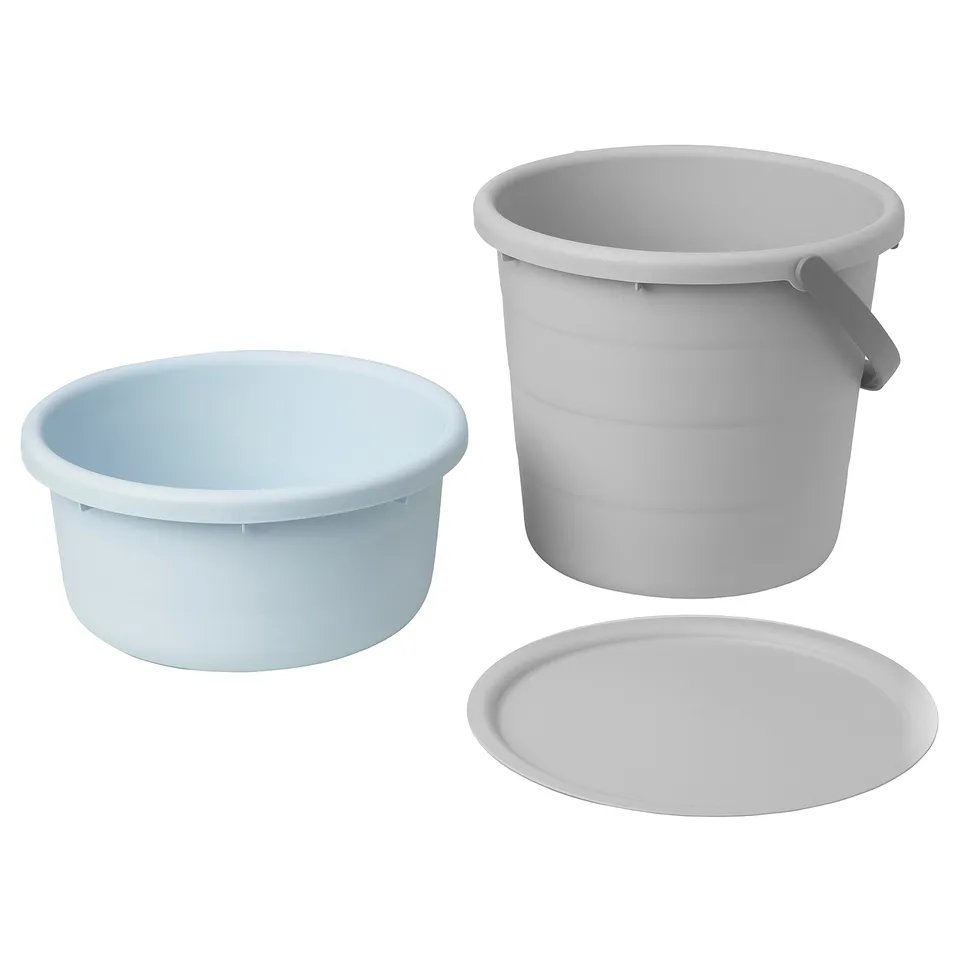 Three plastic buckets, grey and blue, round with handles on two.