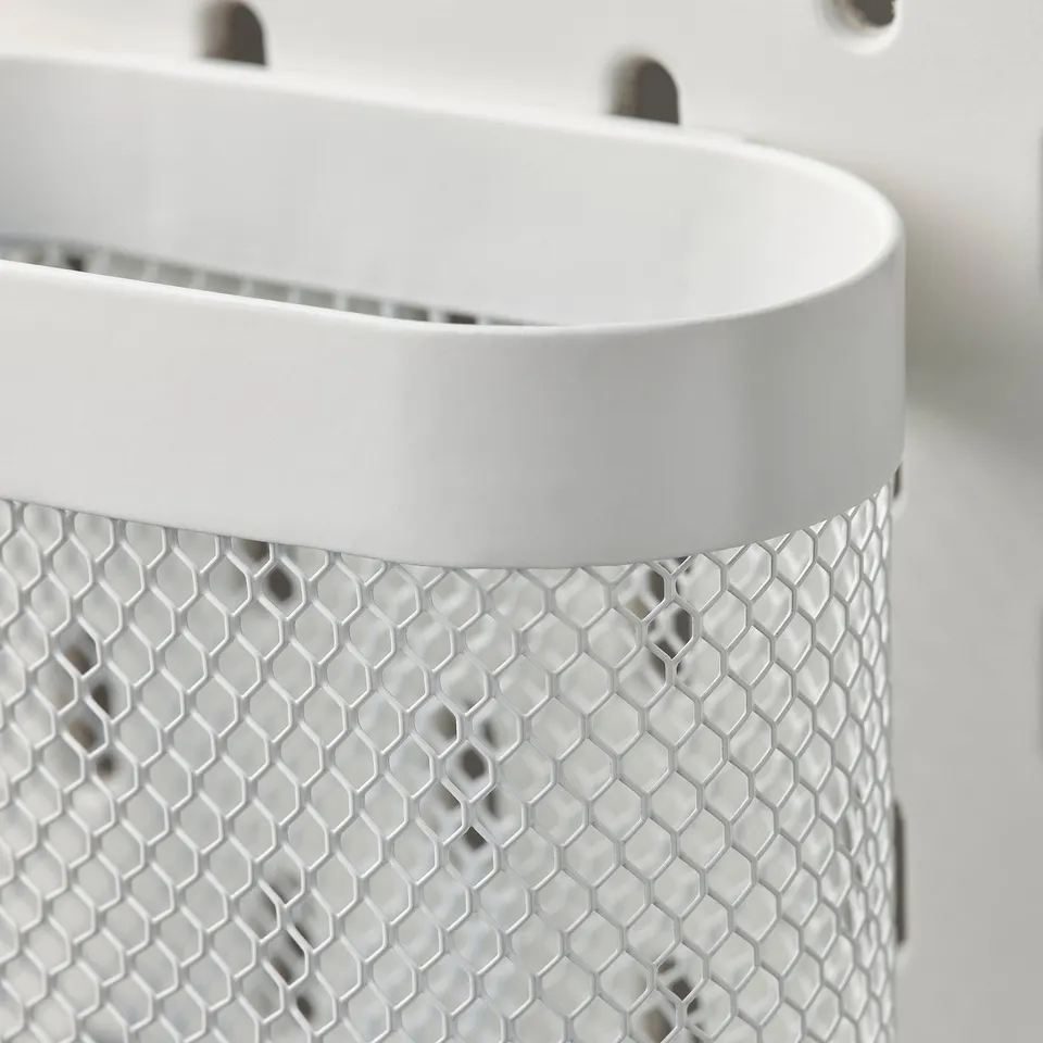 White metal mesh basket with hexagonal pattern, part of SKÅDIS series, designed for organisation.
