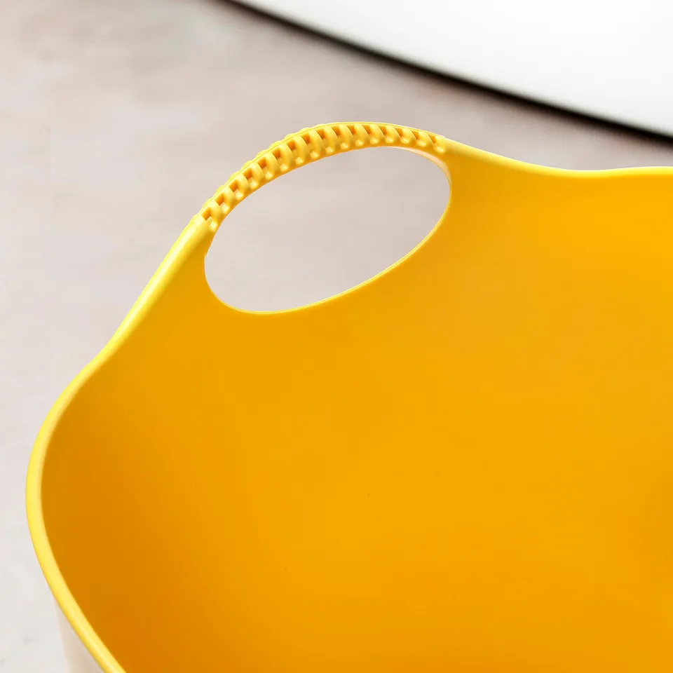 Bright yellow, durable plastic basket with two sturdy handles for easy carrying.