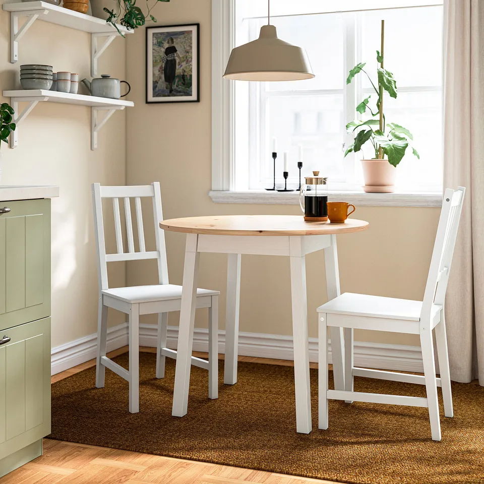 PINNTORP compact dining set with chairs, casual, near window.