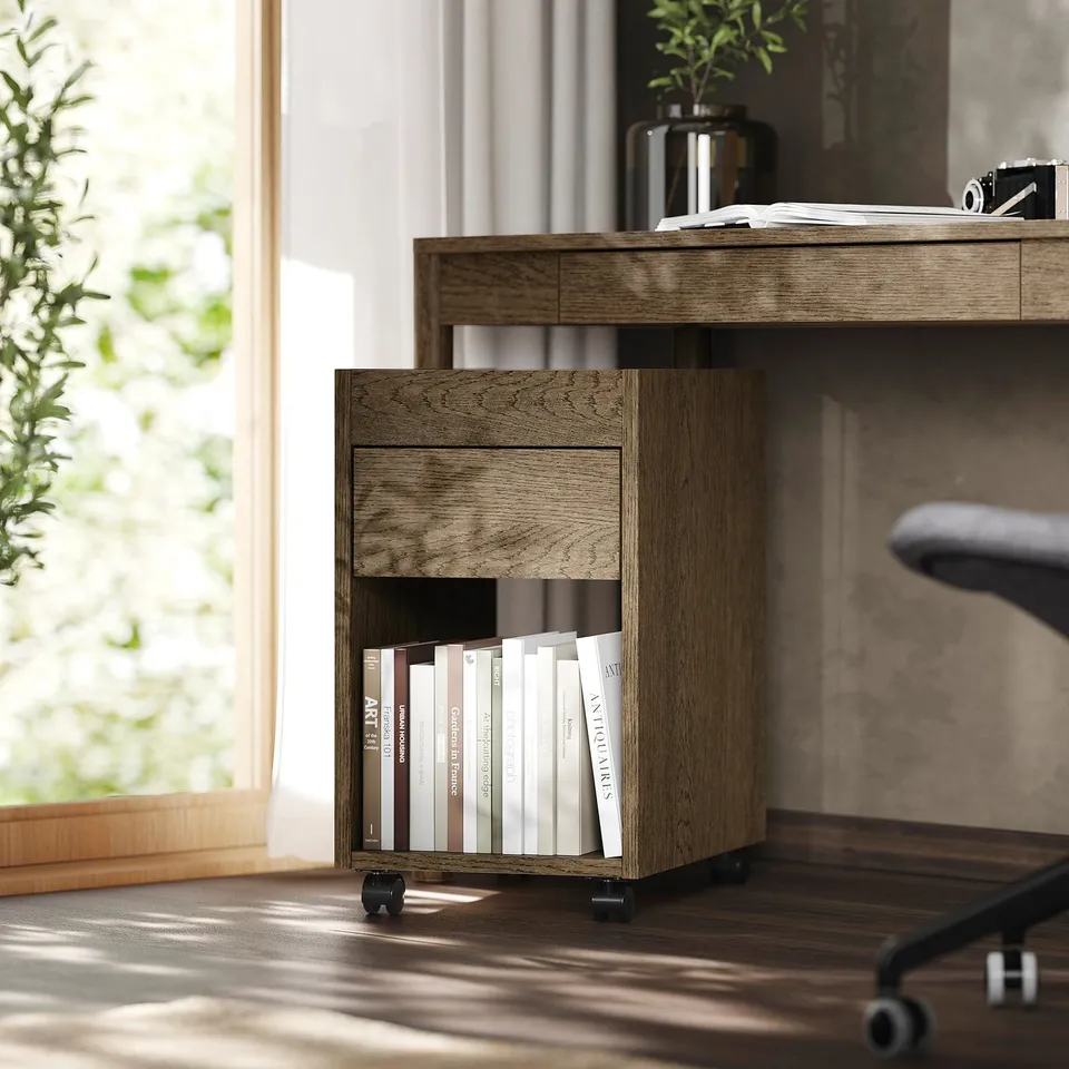 Home office with TONSTAD wooden drawer unit beside desk, holding books & papers.