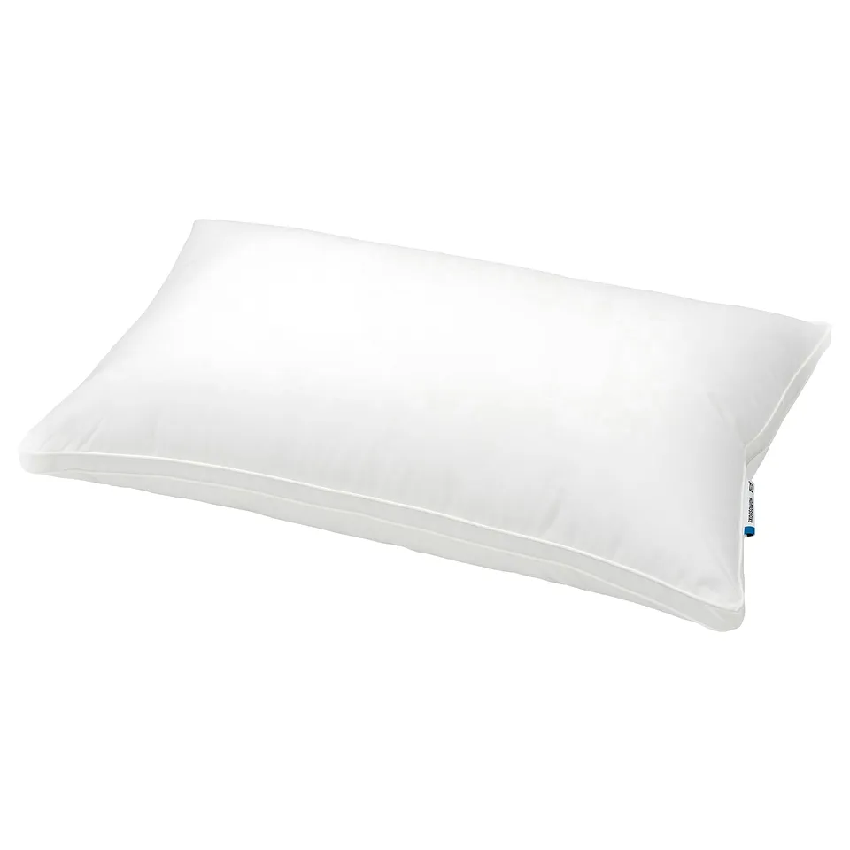 White SKOGSOLVON pillow, soft & supportive, clean edges, smooth.