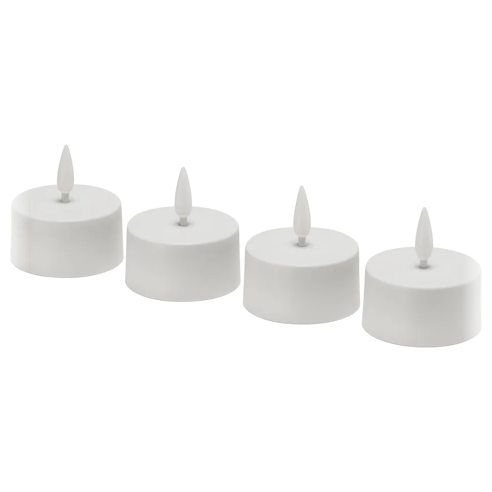 Four white, cylindrical led tealights in a row. Minimalist design, no flicker. Each has a pointed wick. Ideal for decorative lighting.
