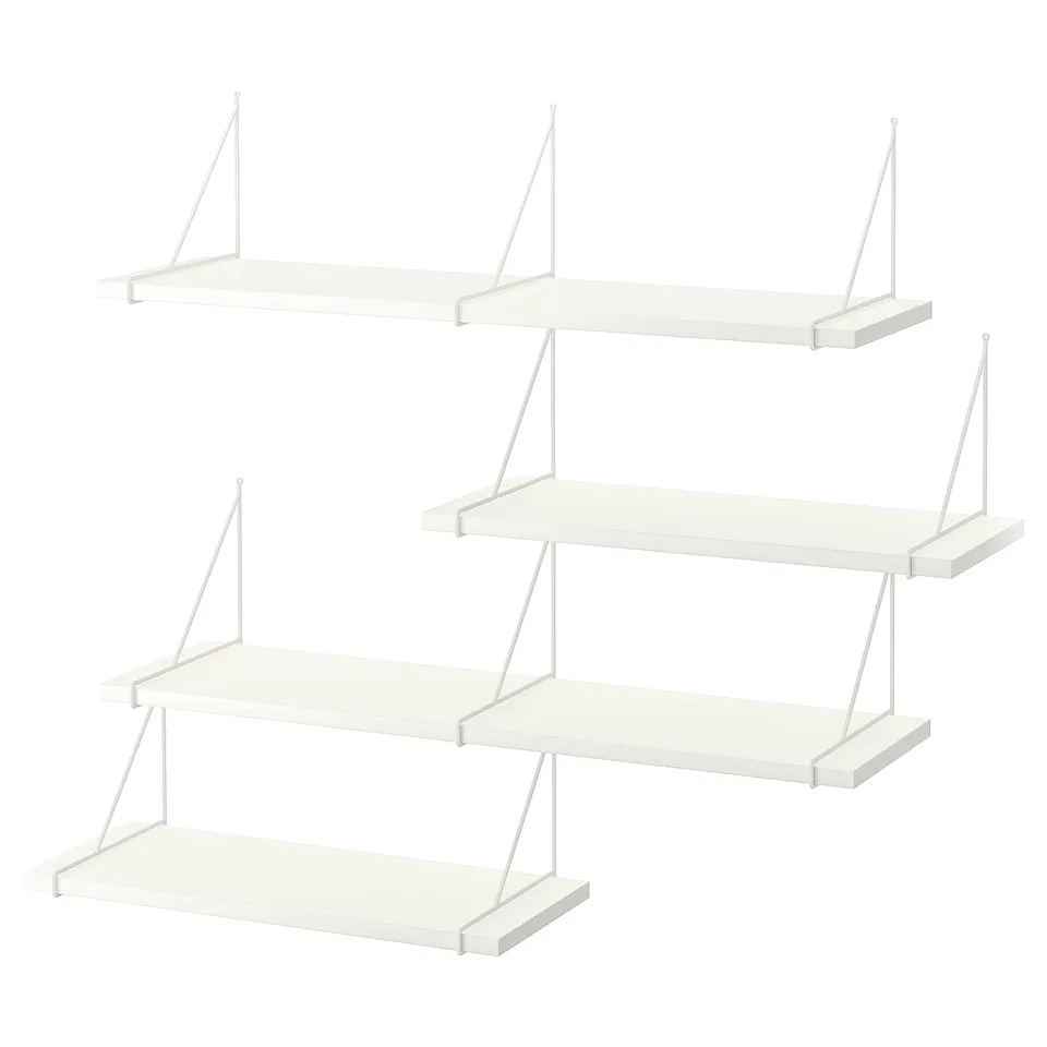 Displays a set of four white BERGSHULT wall shelves with minimalist design and metal brackets.