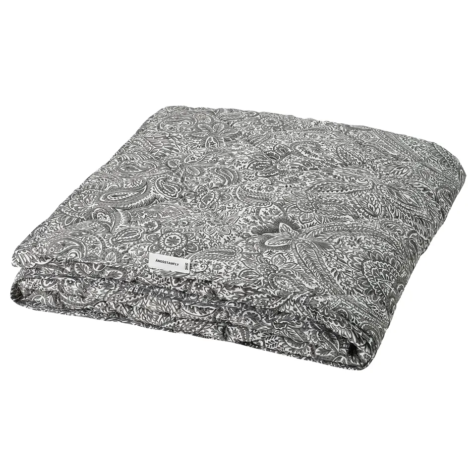 The ÄNGSSTAMFLY duvet is grey with white floral patterns, rectangular, and made from recycled polyester and cotton.