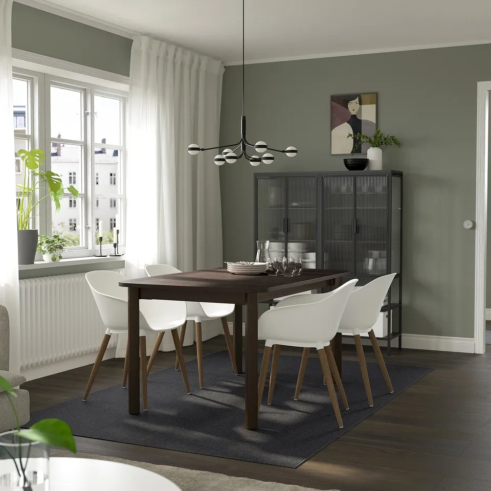 STRANDTORP dining set in grey room with plants and art.