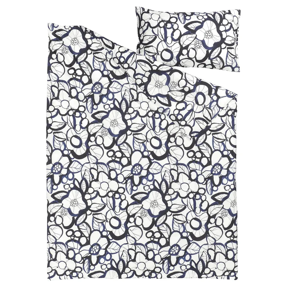A black and white floral patterned bedding set with a pillowcase, made from recycled cotton and lyocell.