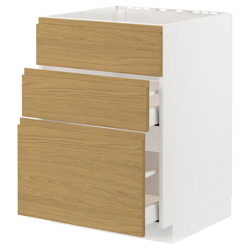 A modern, white METOD kitchen cabinet with oak-colored drawers and built-in handles. Its vertically aligned with three open drawers.