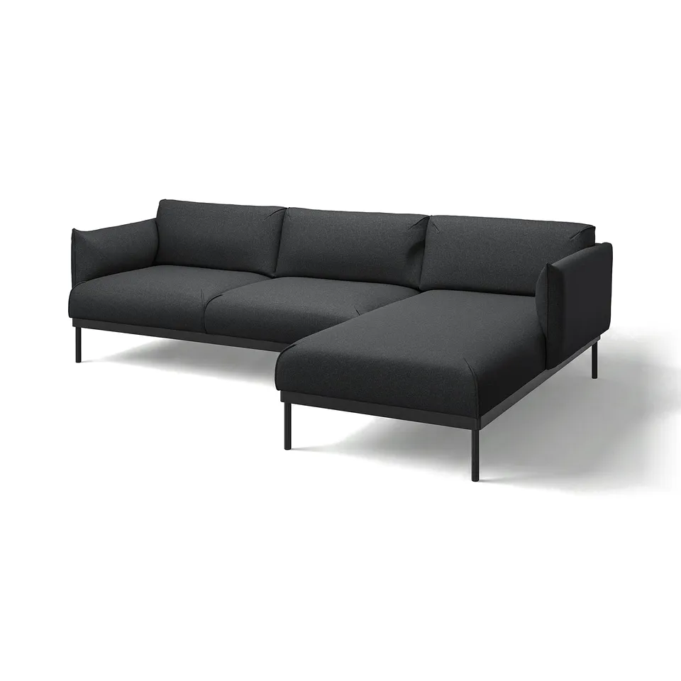 Modern black l-shaped sofa with metal legs, sleek design, and plush cushions.