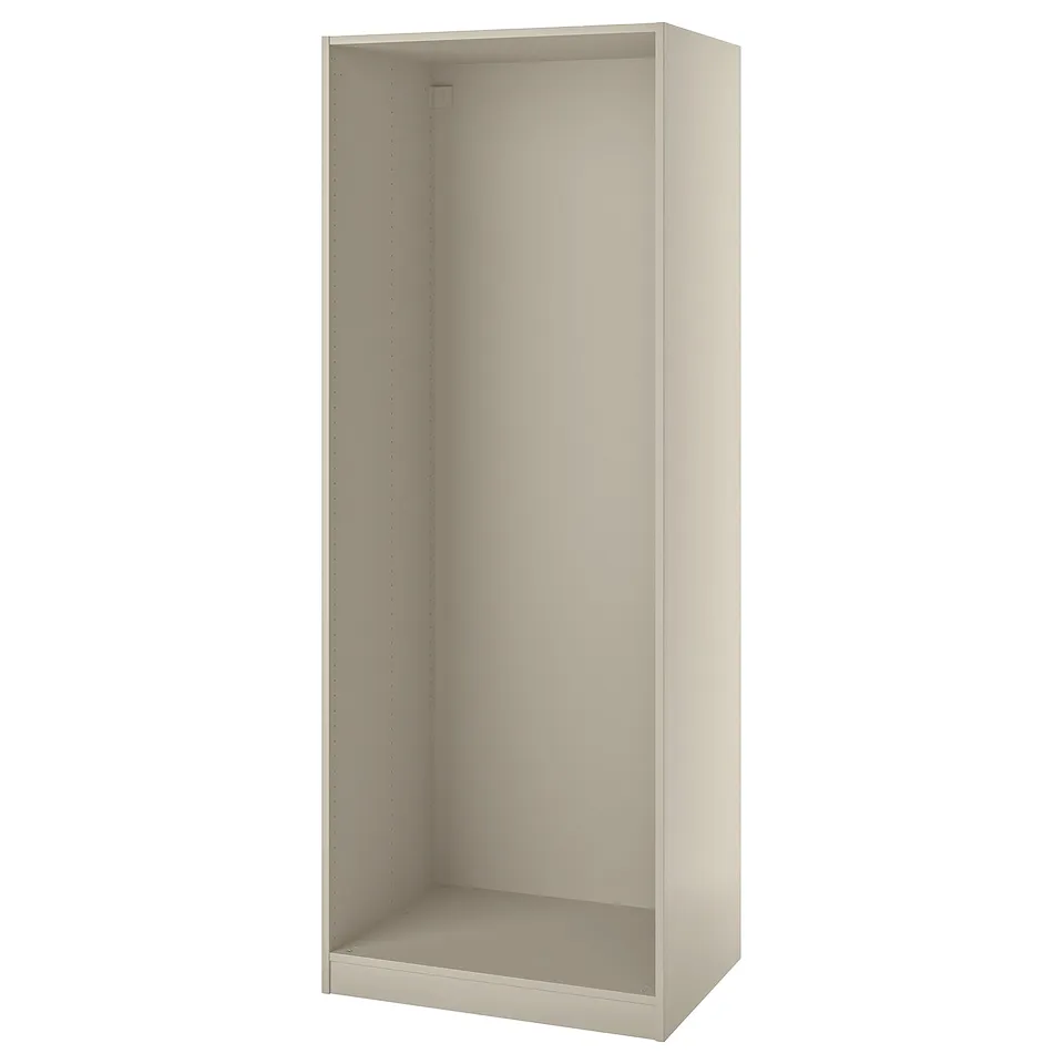 A beige ikea PAX wardrobe frame, rectangular in shape, with adjustable feet and pre-drilled holes for easy assembly.