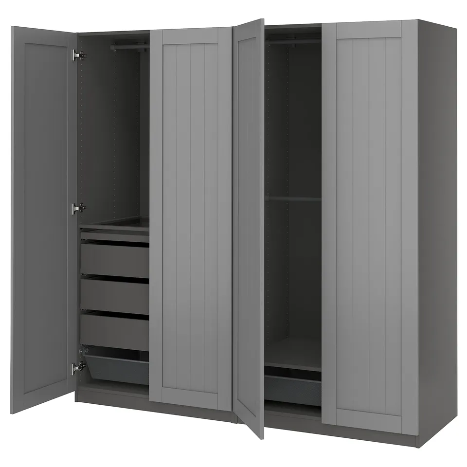 A grey PAX wardrobe with open doors, revealing drawers and shelves inside.