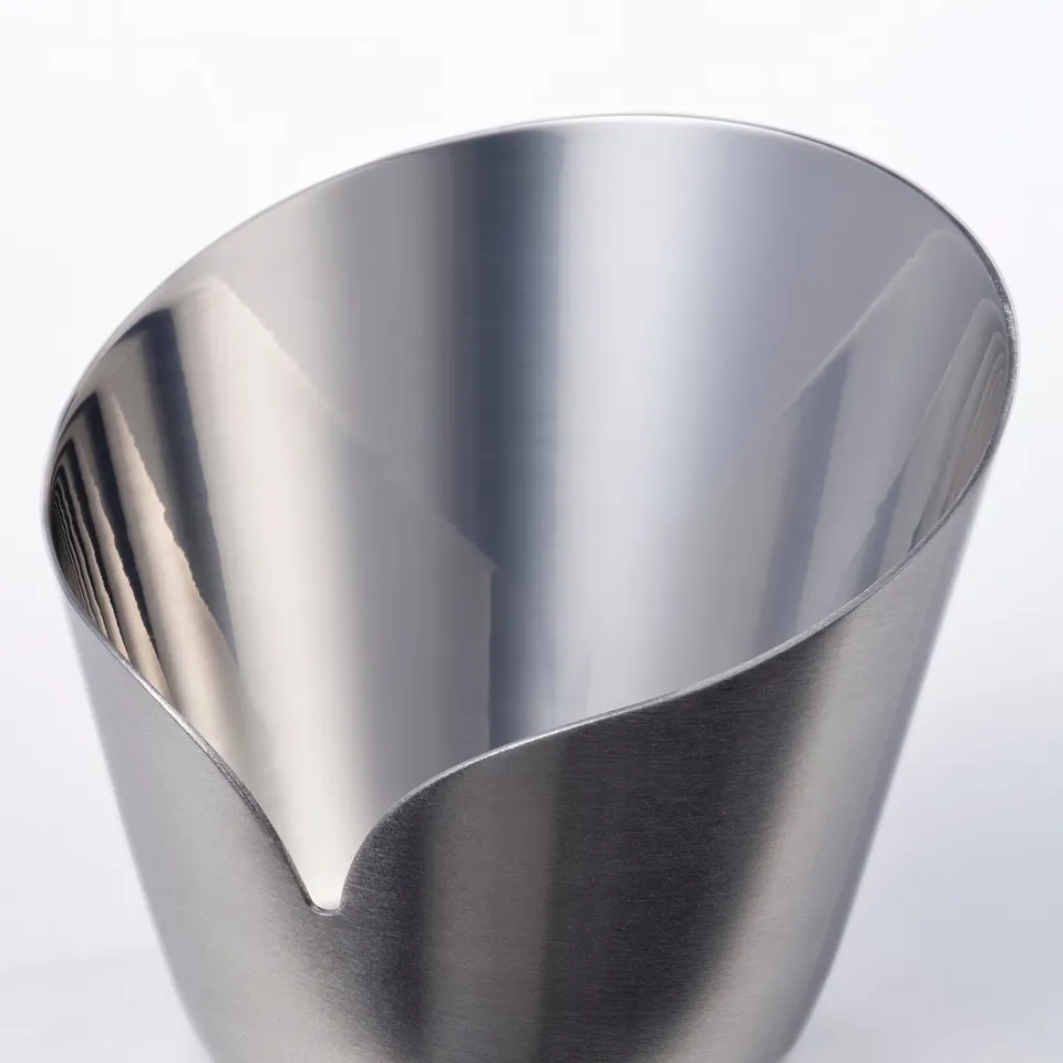 Stainless steel candleholder with smooth, shiny inside and matte outside.