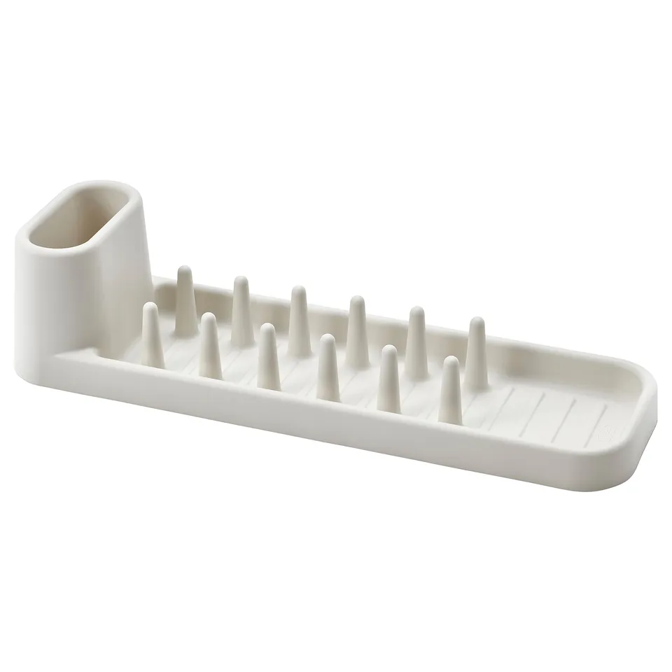 White STÄMLING dish drainer with pegs and cup holder, recycled polypropylene.