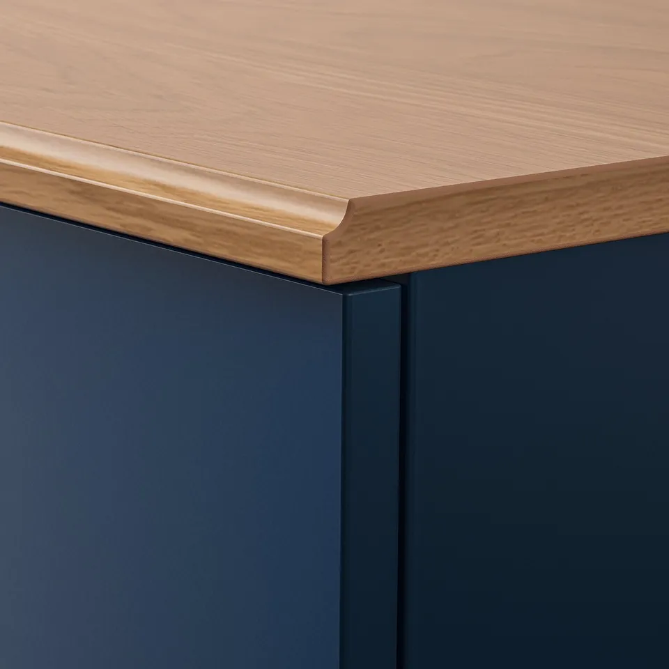 Close-up: sleek, modern drawer with smooth wood grain top and dark grey base; fine craftsmanship evident.