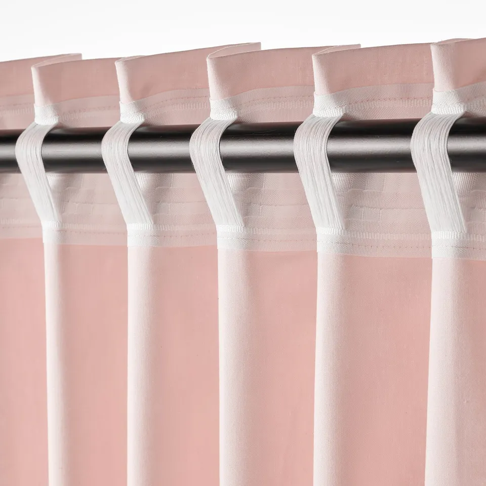 Image shows curtains with looped tabs for rod hanging, offering ease in installation and light control.