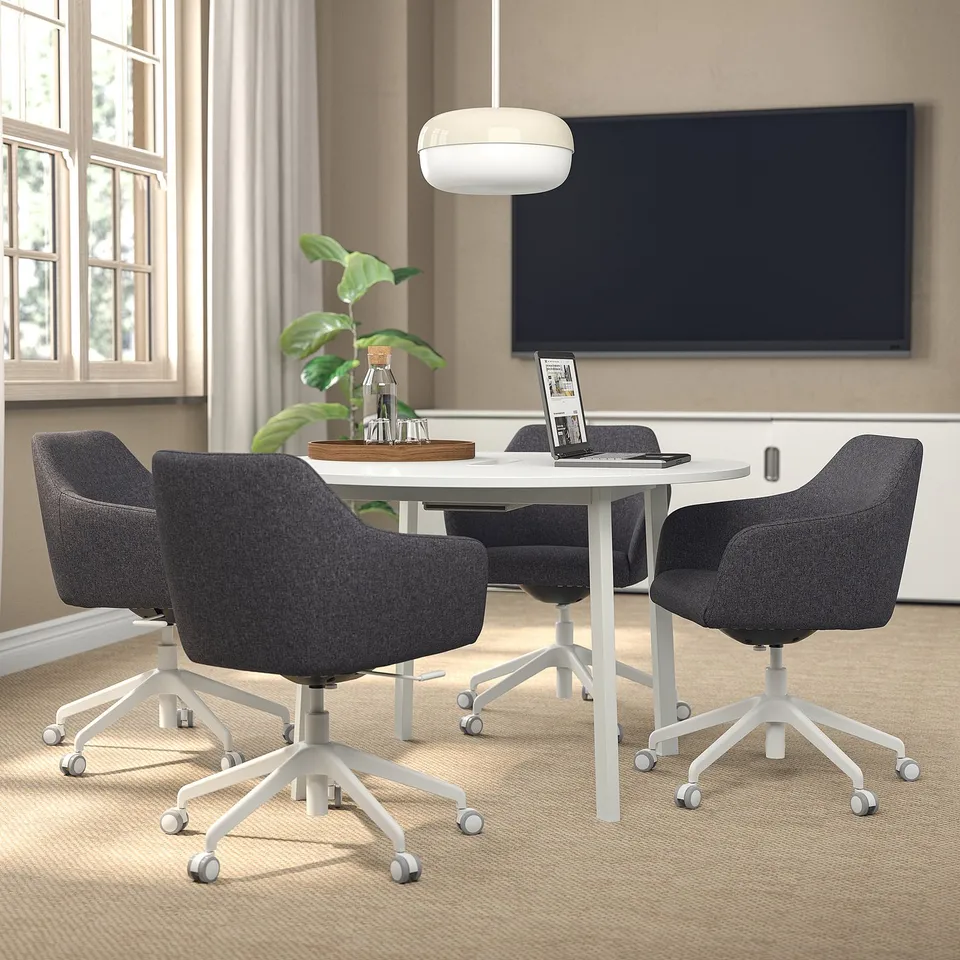 MITTZON conference: round table, chairs, tech, minimal.