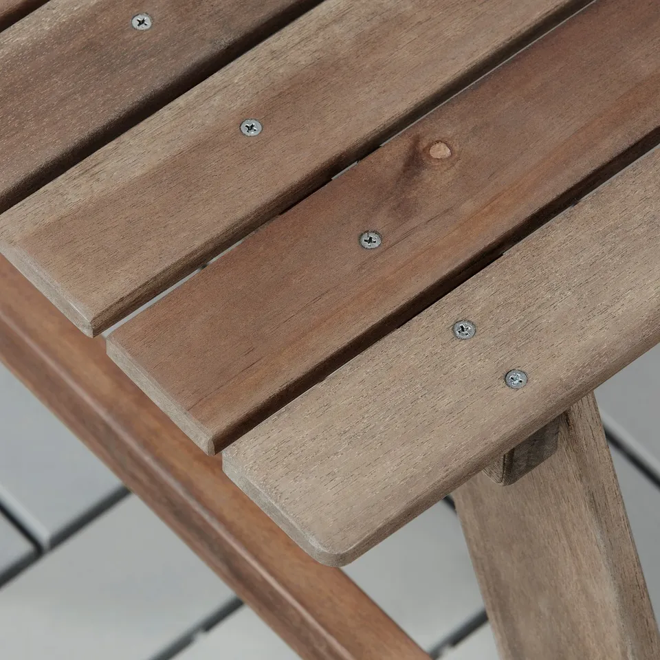 Wooden picnic table for kids, featuring strong acacia wood with visible screws, ensuring durability and stability.