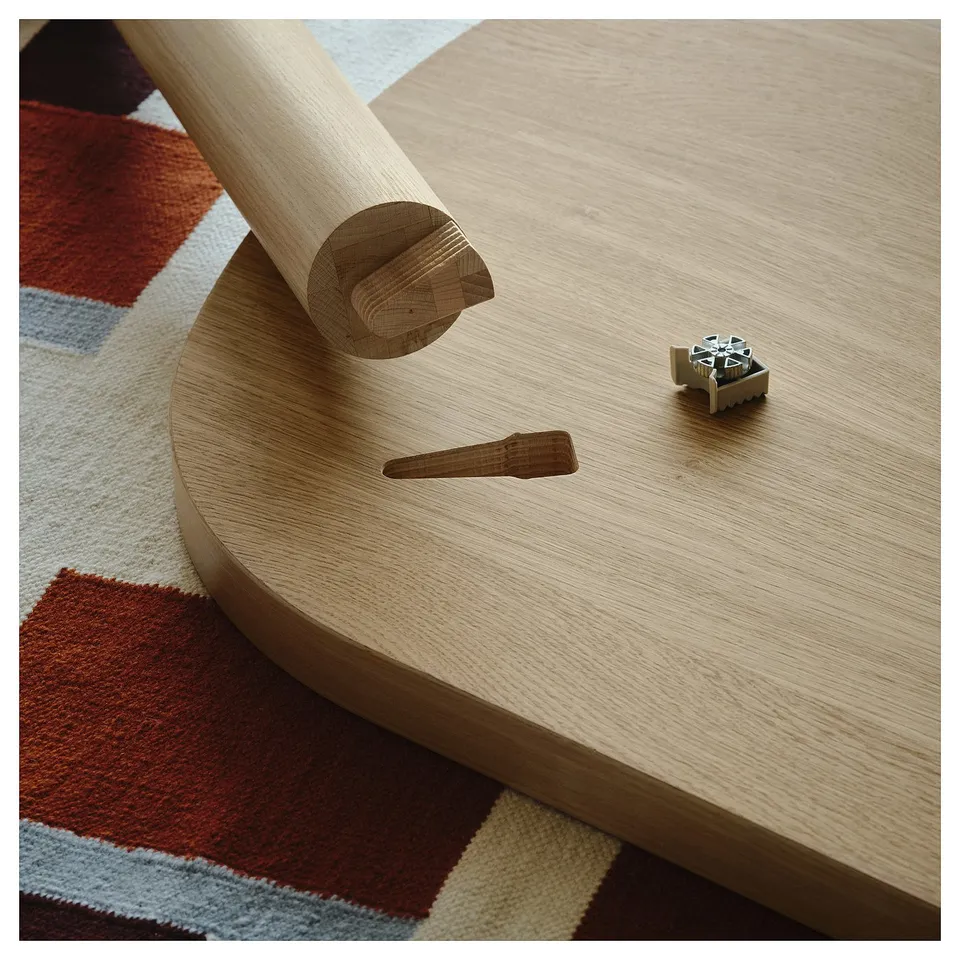 Wooden table and chair assembly piece with natural rattan detail.
