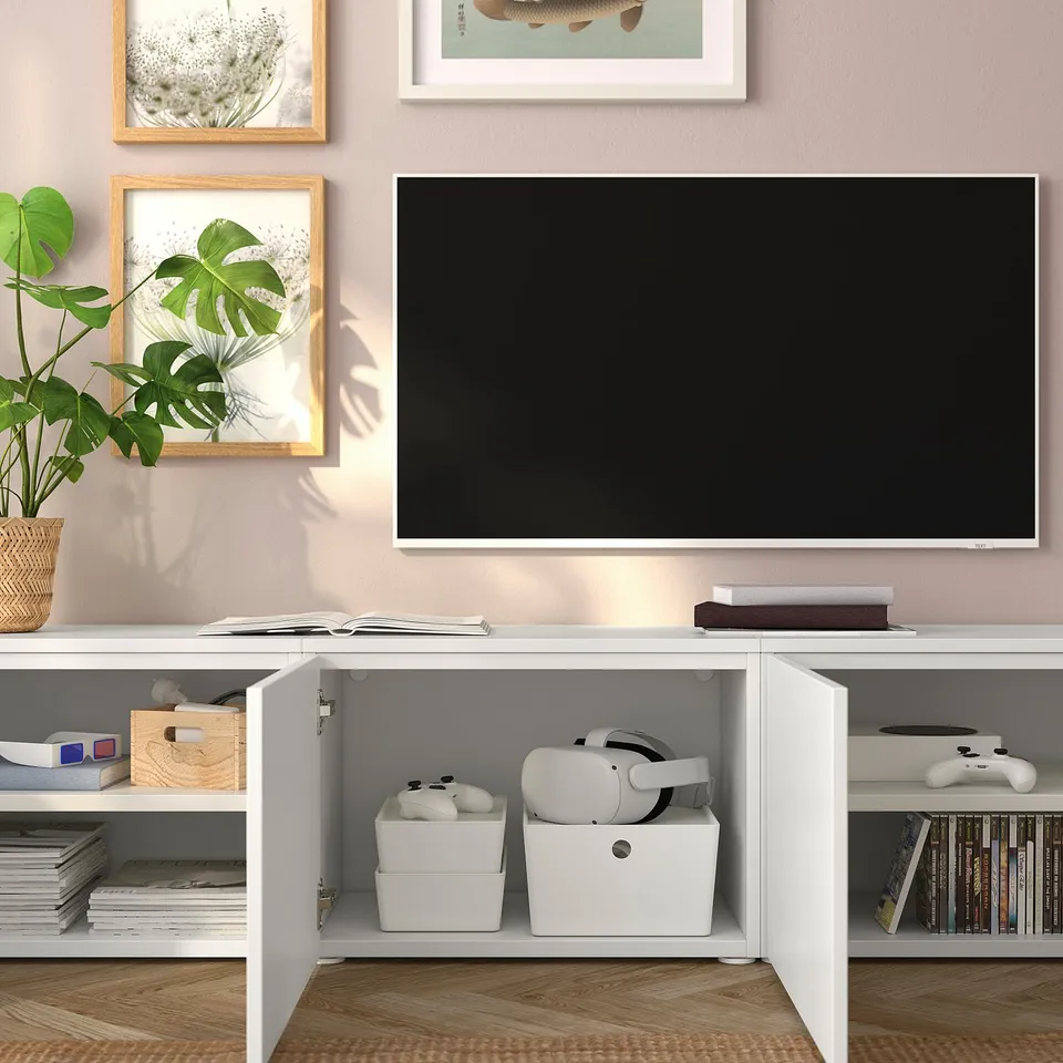 Modern living room with PLATSA storage unit for gaming, books, and tv.