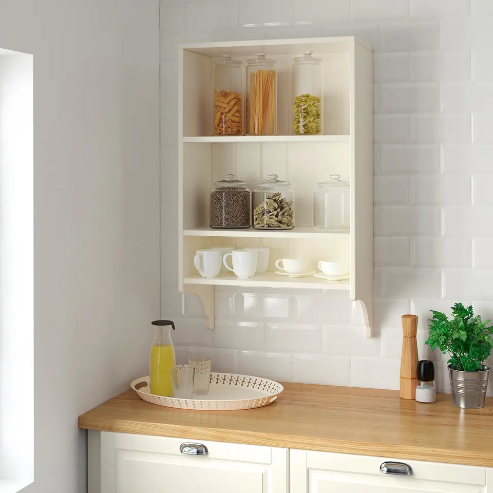 TORNVIKEN wall shelf with jars, cups, and kitchen items.