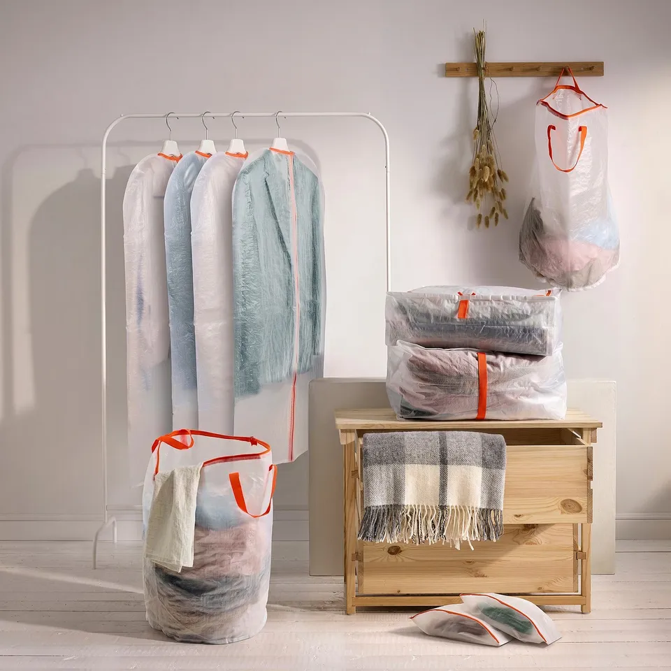 White & orange PÄRKLA covers on rack, drawer, floor - dust protection, medium size