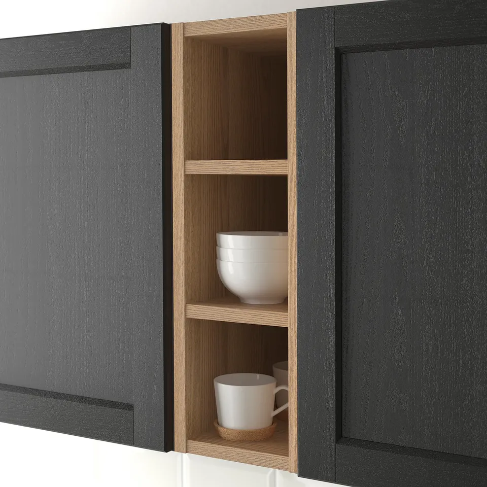 Open kitchen cabinet displaying white bowls and mugs, showing storage and organisation functionality.