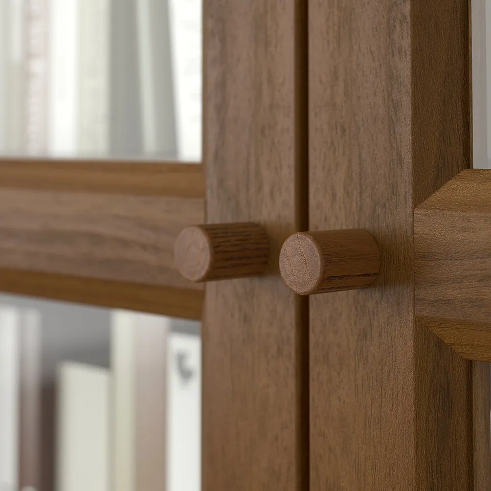 Wooden cabinet with rounded knobs, showcasing quality craftsmanship and natural grain texture.
