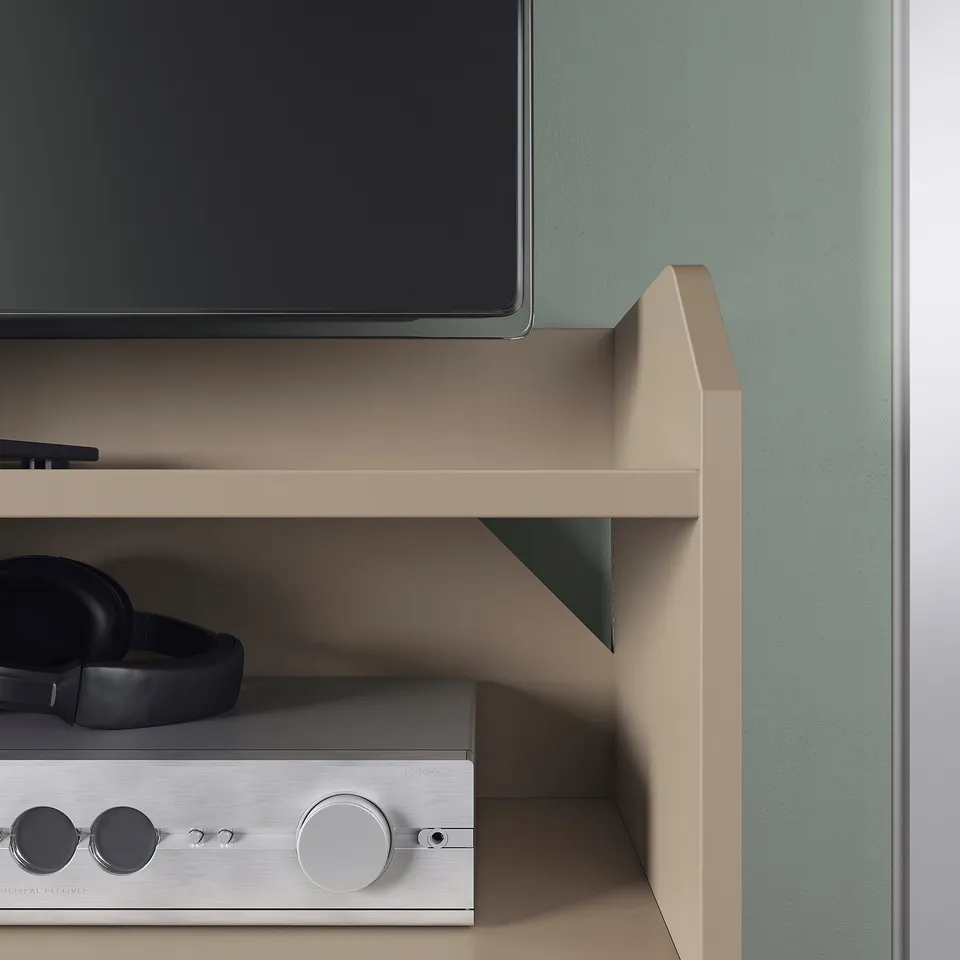 Modern tv stand with flat-screen tv, headphones, and stereo receiver