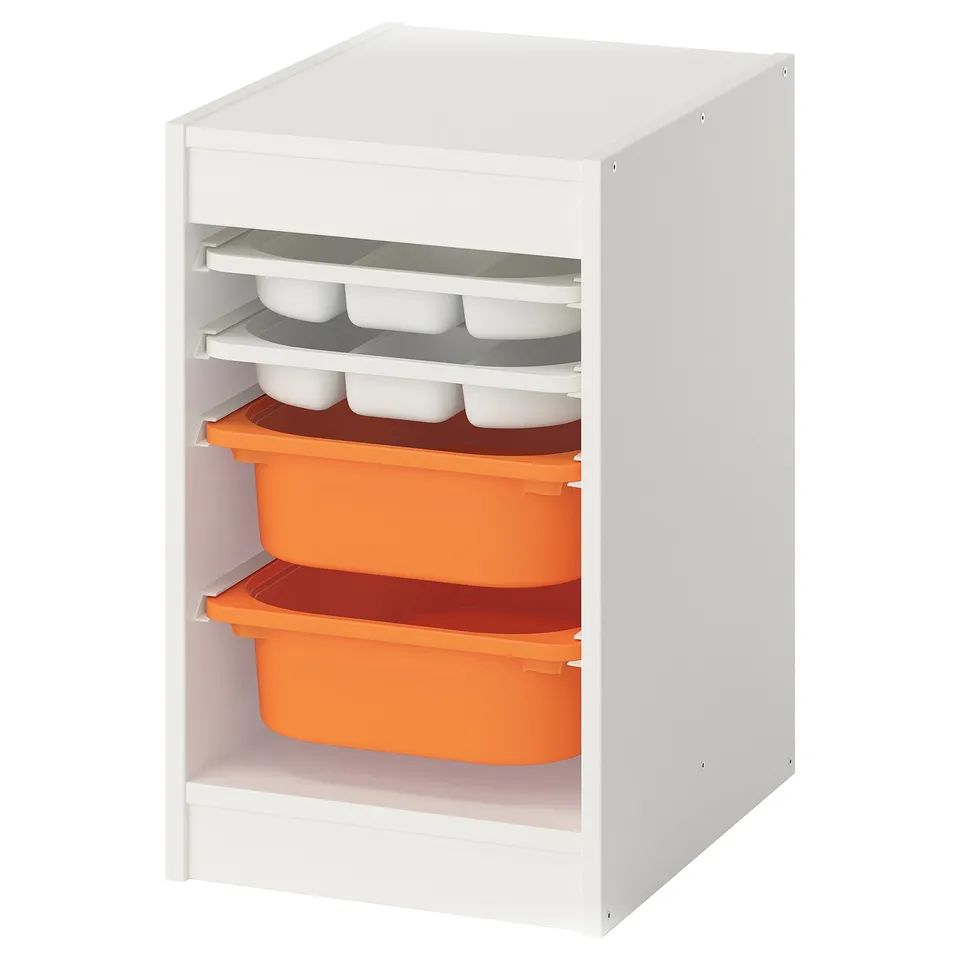 A white TROFAST storage unit with orange containers. It has multiple shelves holding trays and containers for organising items.