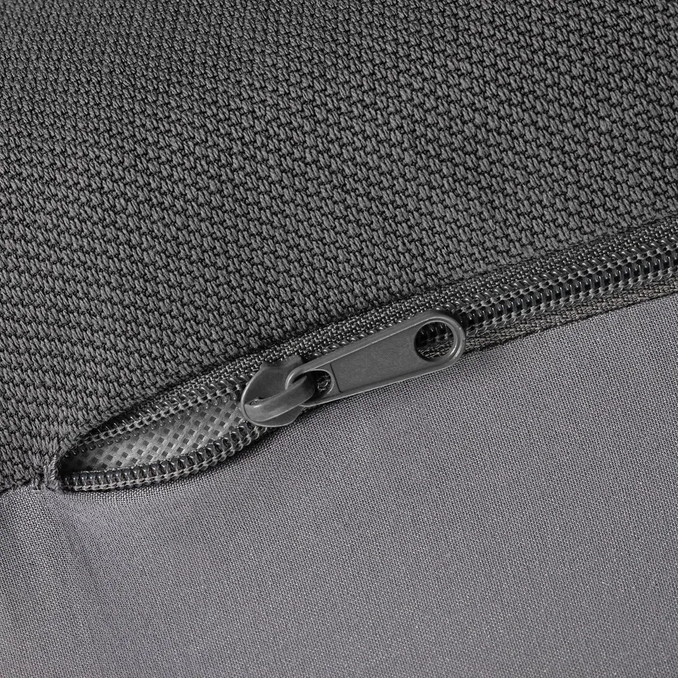Close-up zip on durable, textured fabric.