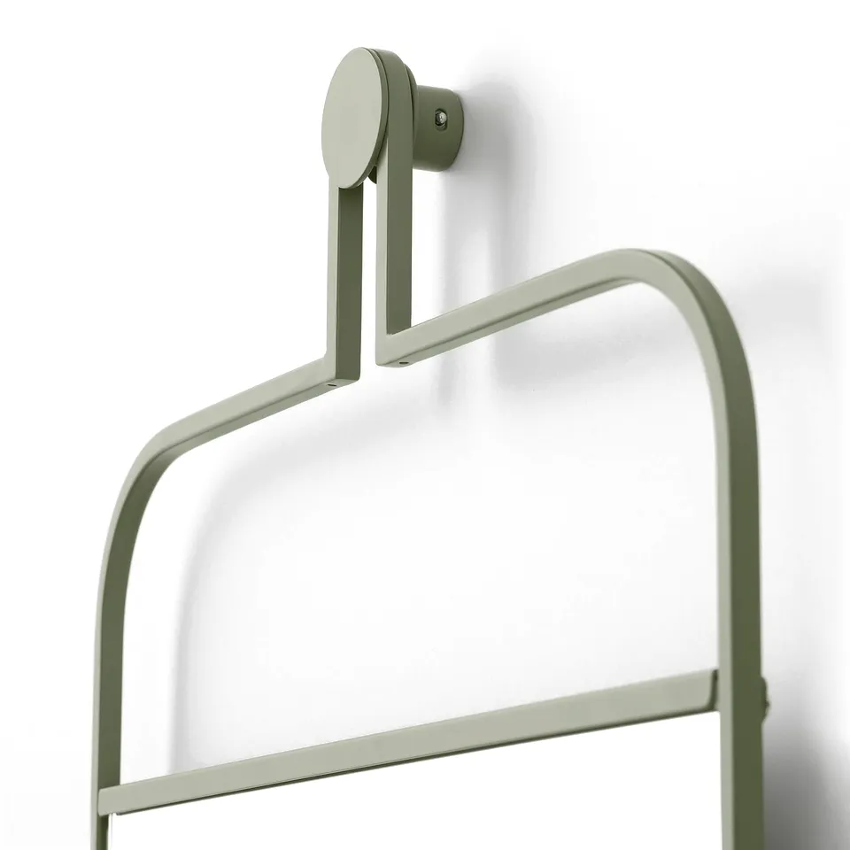 Sleek sage green wall-mounted mirror with rail for hanging accessories. Modern design, sturdy construction. Perfect for bedrooms or hallways.