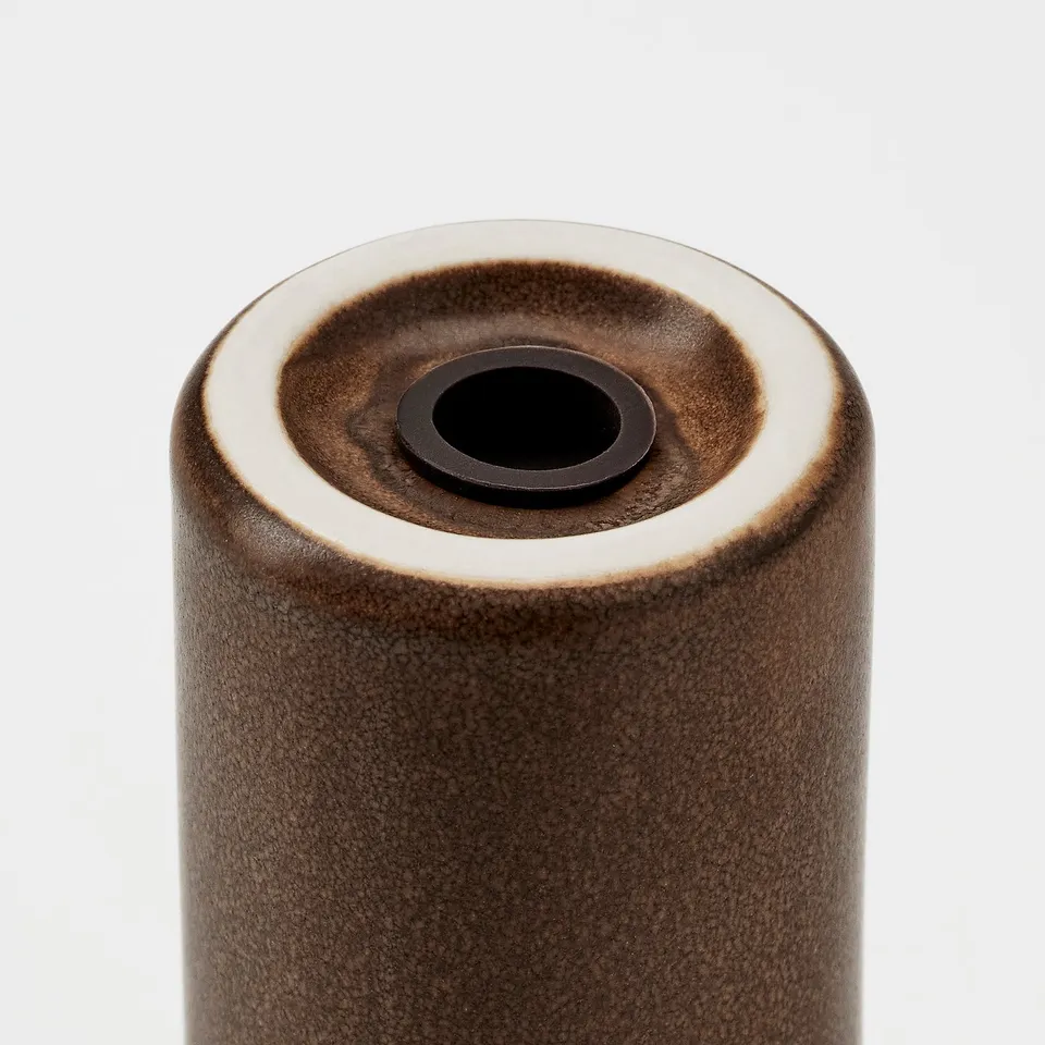 Rustic stoneware spice jar, glazed finish, cylindrical shape.