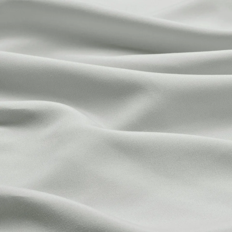 Soft, grey fabric closeup, showcasing smooth, wrinkle-free texture.